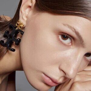 Tory Burch Vintage Black Logo Earrings are a stylish gift for couples.